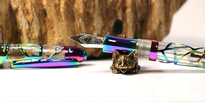 sweet_and_sassy_brassy_cat_pen_rests_playful_cat