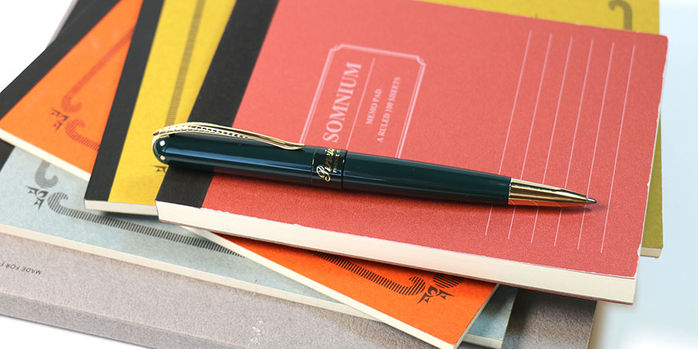 pineider_avatar_ur_anniversary_ballpoint_pen_on_notebook