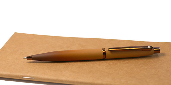 sheaffer_vfm_coffee_edition_ballpoint_pen_on_notebook