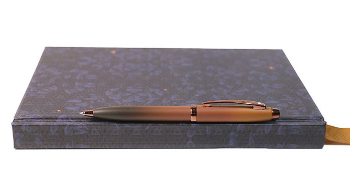 sheaffer_100_coffee_edition_ballpoint_pen_on_notebook