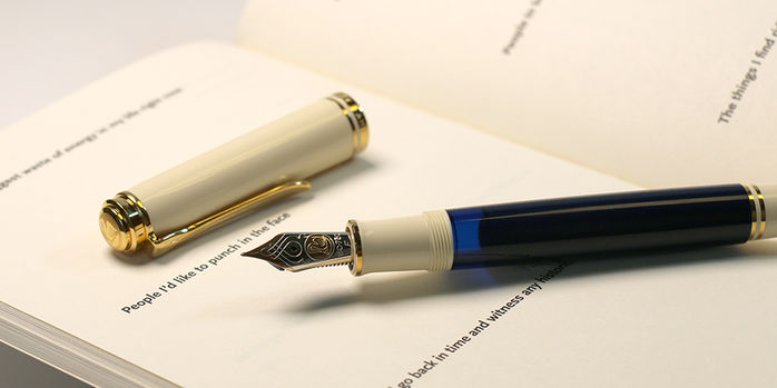 pelikan_special_edition_souveran_800_cream_blue_fountain_pen_uncapped_in_notebook