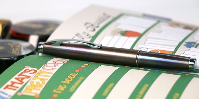 monteverde_dakota_raw_flame_fountain_pen_capped_in_planner