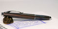 monteverde_dakota_raw_flame_fountain_pen_capped_on_sweet_and_sassy_brassy_cat_pen_rest