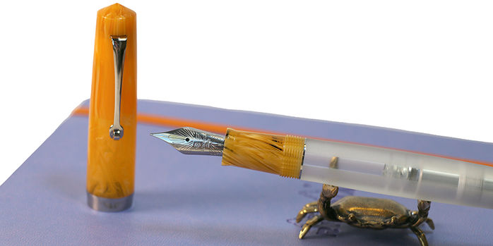 leonardo_momento_zero_magico_vista_flame_fountain_pen_uncapped_with_sassy_brassy_cat