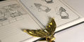 brass_page_holder_mermaid_tail_with_log_of_elixir_wood_stamp