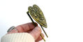 brass_page_holders_lovestruck_bookmark_in_hand_from_side