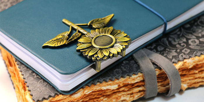 sunflower_brass_page_holders_in_fether_notebook