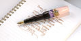 benu_pixie_plum_cream_writing_sample_in_notebook