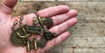 travelers_notebook_brass_3d_charms_in_hand