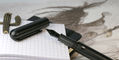 nahvalur_nautilus_ti_black_fountain_pen_uncapped_on_notebook