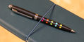 monteverde_illusia_gel_ballpoint_pen_tropical_punch_on_notebook