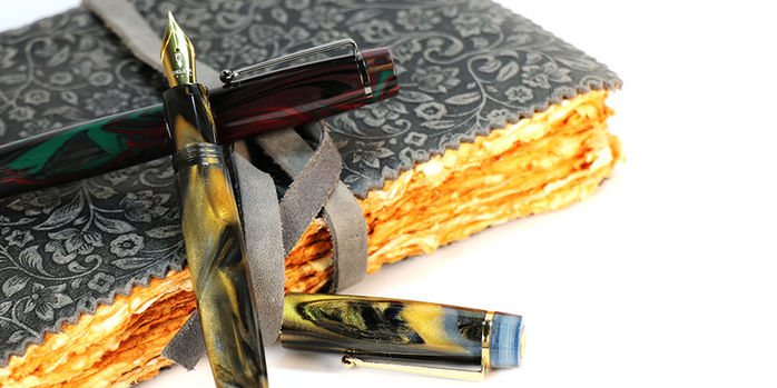 delta_signs_of_time_renaissance_and_medieval_art_fountain_pens_with_one_uncapped
