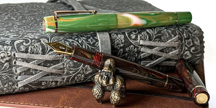 delta_signs_of_time_rococo_and_barocco_fountain_pens_with_sassy_brassy_gorilla_pen_rest
