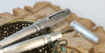 leonardo_officina_italiana_momento_zero_alumina_fountain_pens_one_uncapped_on_vase