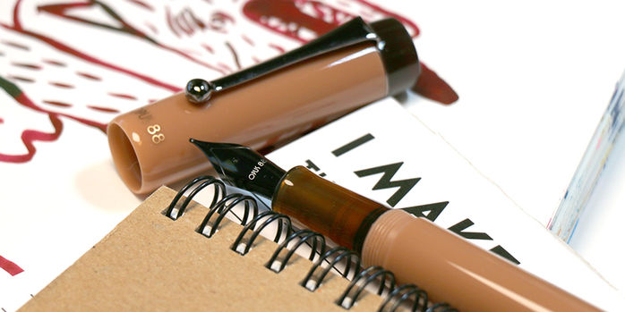opus_88_demo_pvd_mocha_mousse_fountain_pen_uncapped_on_pen_rest