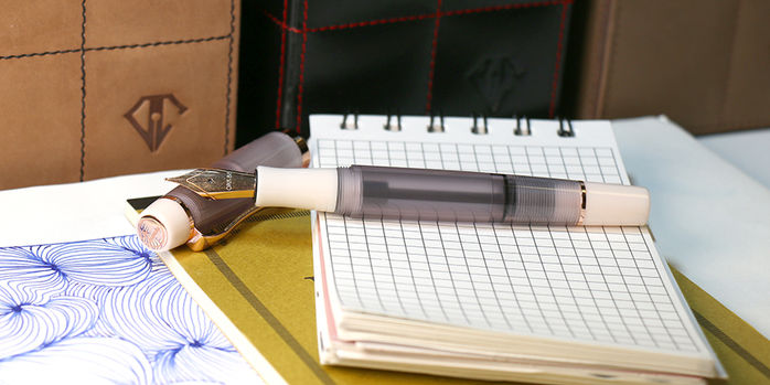 opus_88_2025_harmony_fountain_pen_uncapped_on_notebook