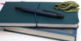 link_midnight_vanishining_point_on_notebook_with_strap