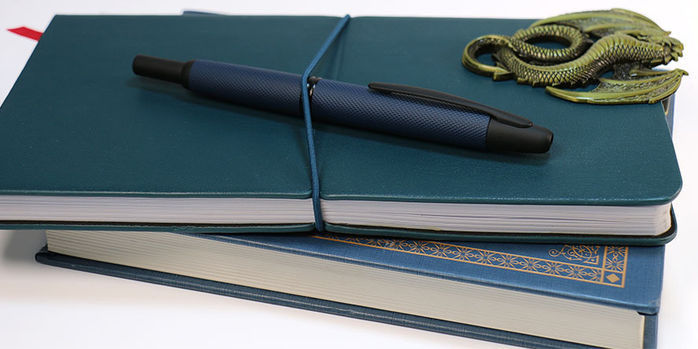 link_midnight_vanishining_point_on_notebook_with_strap