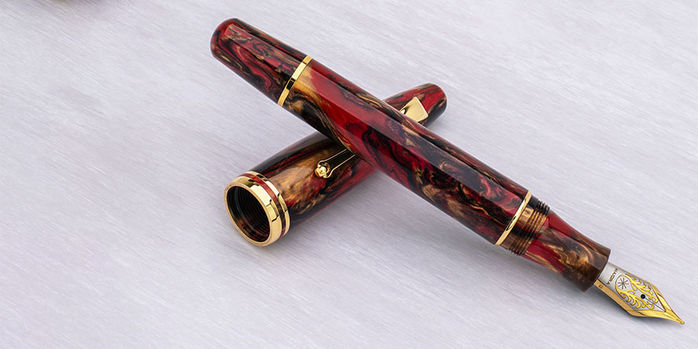 maiora_ultra_ogiva_golden_rule_fountain_pens_resting_on_cap