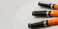 delta_dv_original_mini_ballpoint_pen_beside_rollerball_and_fountain_pen