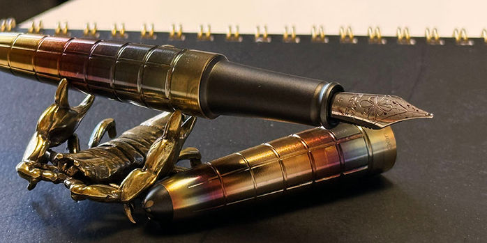 sassy_brassy_scorpion_pen_rest_with_diplomat_aero_rhomb_flame_fountain_pen_nib