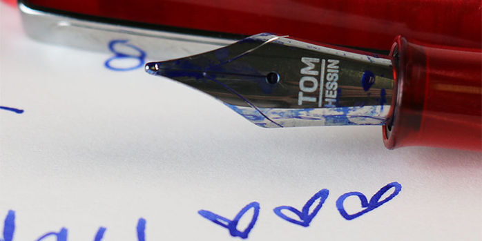 tom_hessin_exhibition_red_fountain_pen_b_nib_inked_with_platinum_pigment_blue_ink