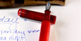 tom_hessin_exhibition_red_fountain_pen_b_nib_inked_with_platinum_pigment_blue_ink_nib_on_cap