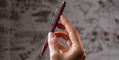 Caran_dAche_Toile_ballpoint_burgundy_hand